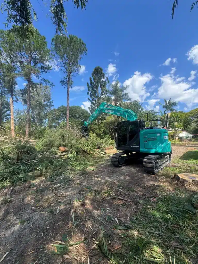 land-clearing-brisbane-southside-with-excavator-clearing-tree-debris