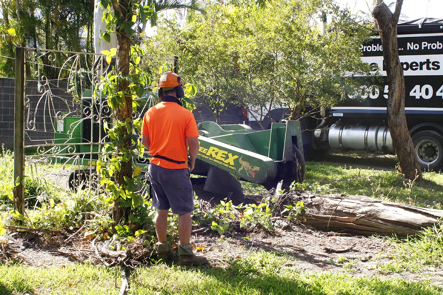treesafe-stump-grinding-equipment-and-truck-on-a-residential-tree-removal-site